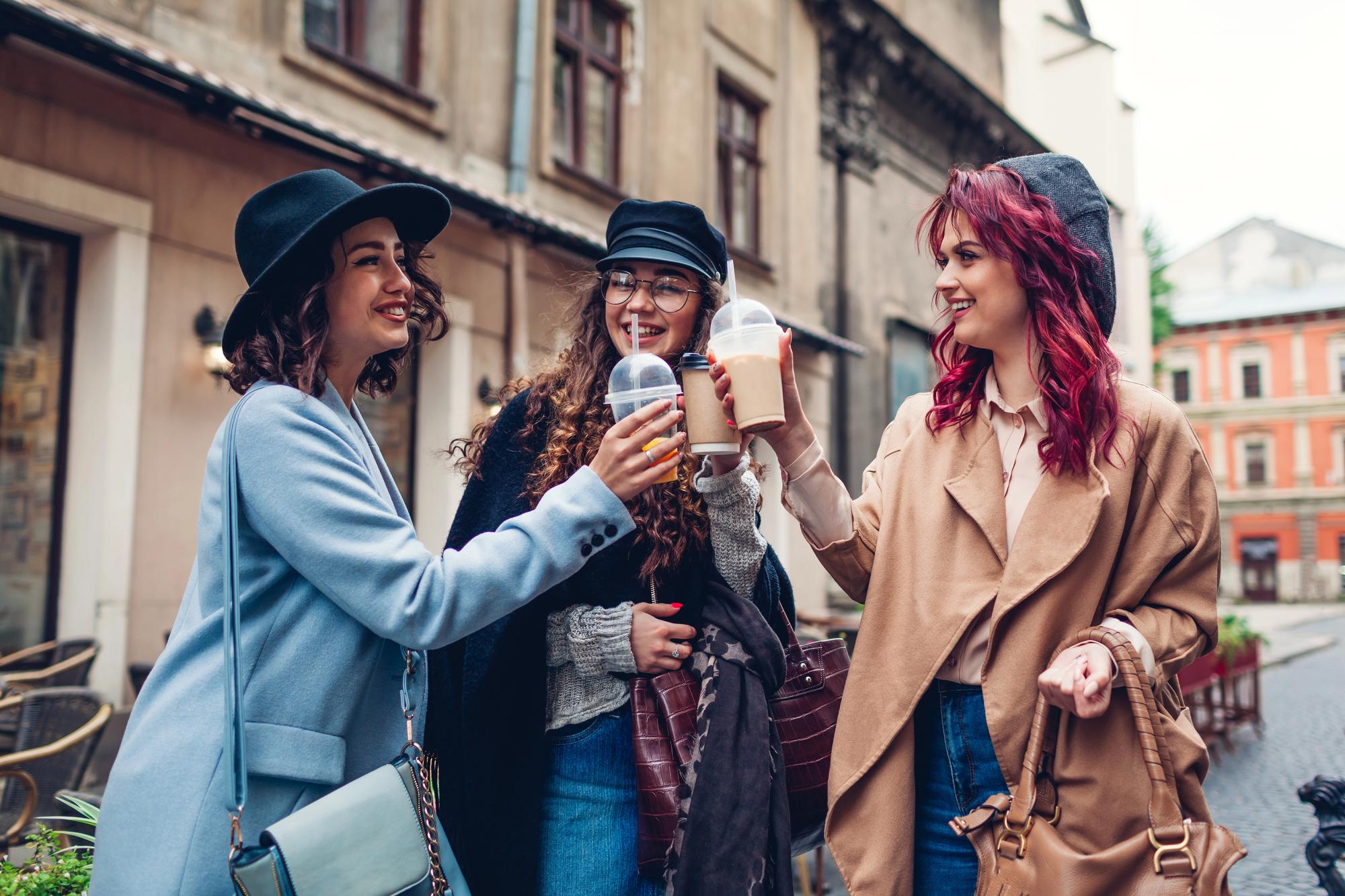 How to Meet People While Traveling Alone: Best Tips for Solo Travelers - New Friends Hanging Out with Drinks While on Vacation