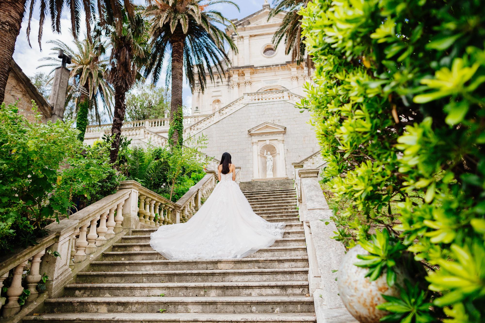 Why Hire a Travel Advisor for Your Destination Wedding? - Bride on Steps at Church