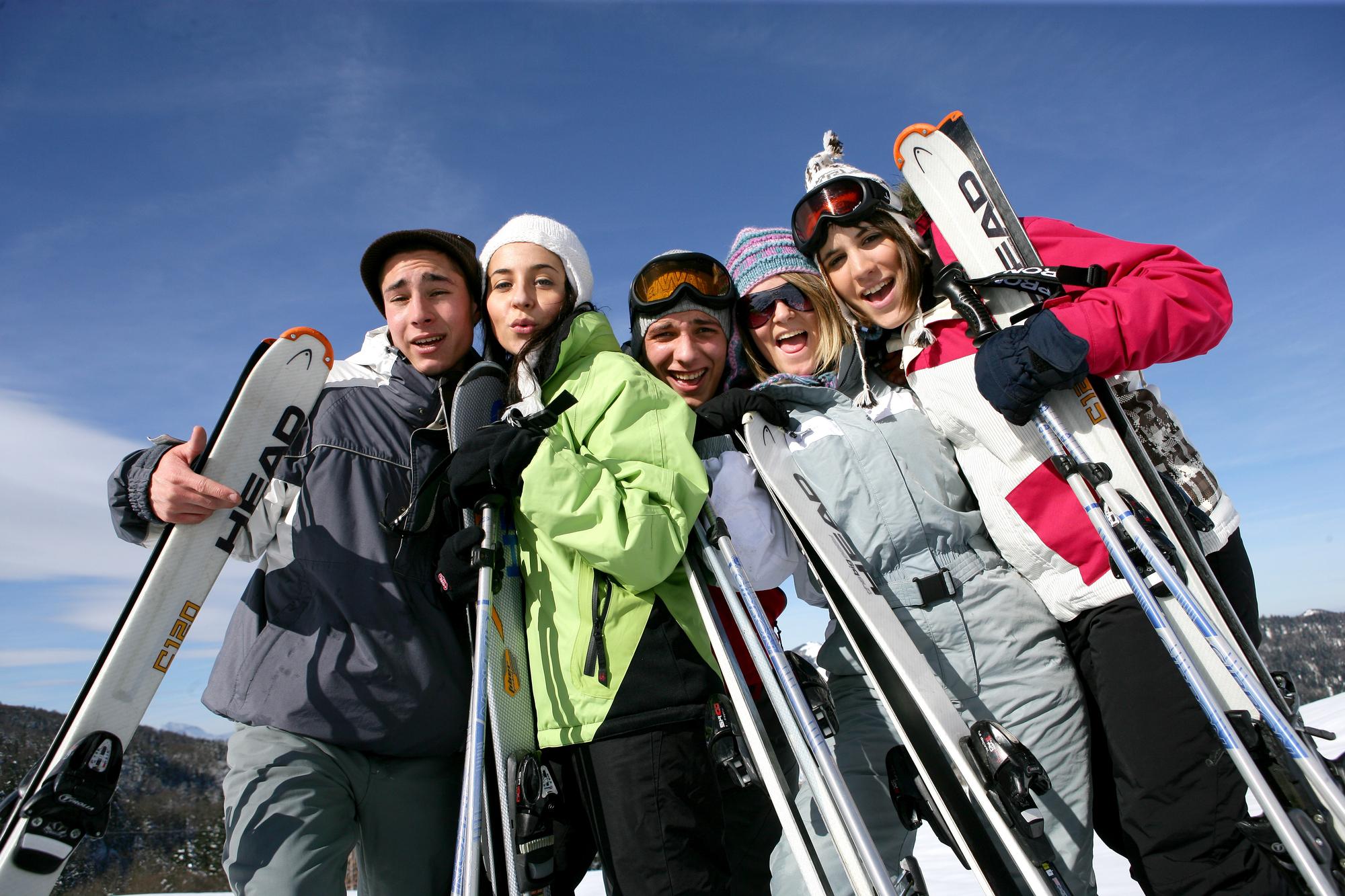Summer vs Winter Travel Destinations: Where to Go and When to Go - Family Skiing at a Winter Travel Destination